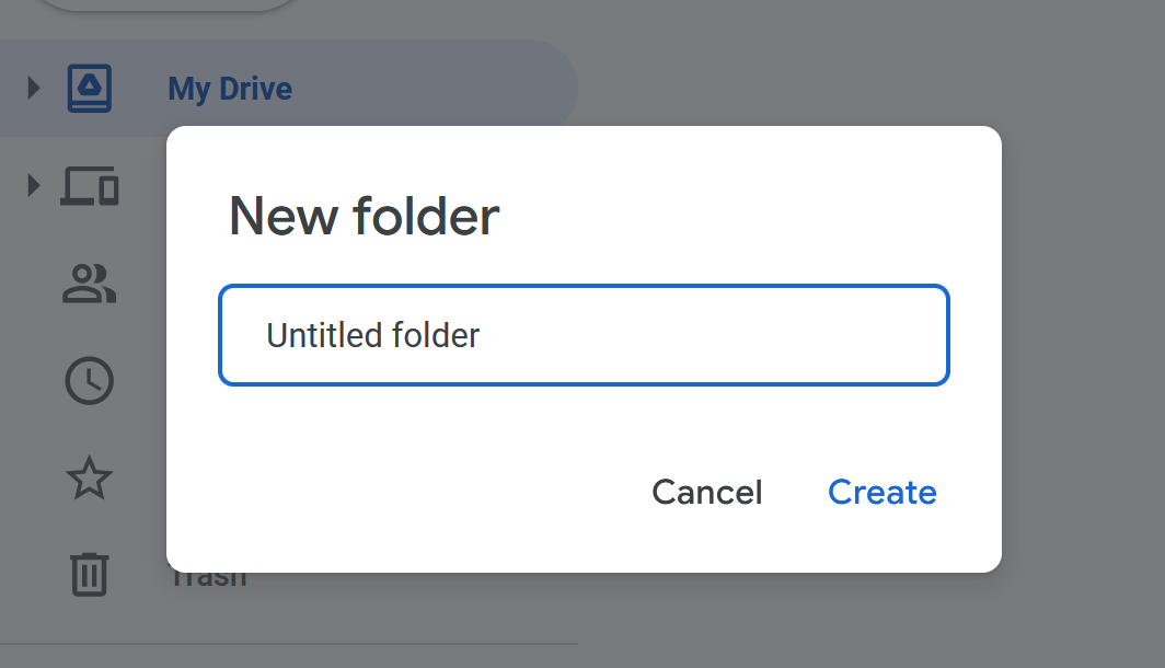 A box resting above other elements of Google Drive showing "New folder" with a "Create" and "Cancel" button